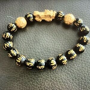 Buddha power black gold stretch bracelet with bag
